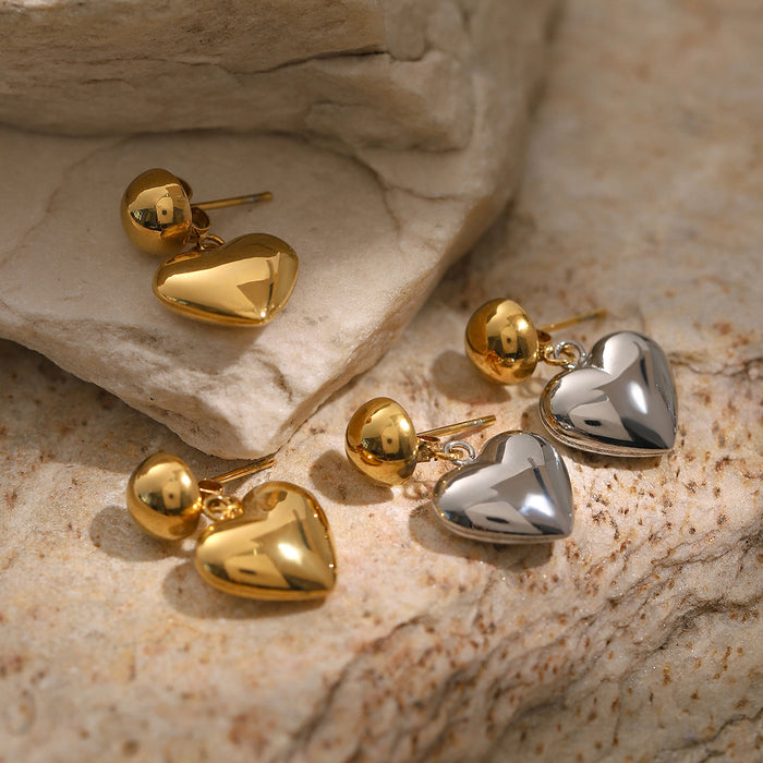 Pendientes asimétricos de acero inoxidable y oro de 18 quilates con forma de corazón: joyas con un diseño único en dos tonos