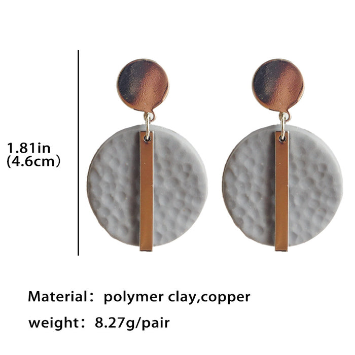 Pendientes geométricos de arcilla metálica hechos a mano: joyería minimalista de alta gama