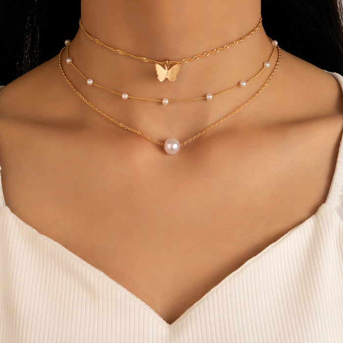 Moon and Shell Triple-Layer Necklace with Cross Pendant