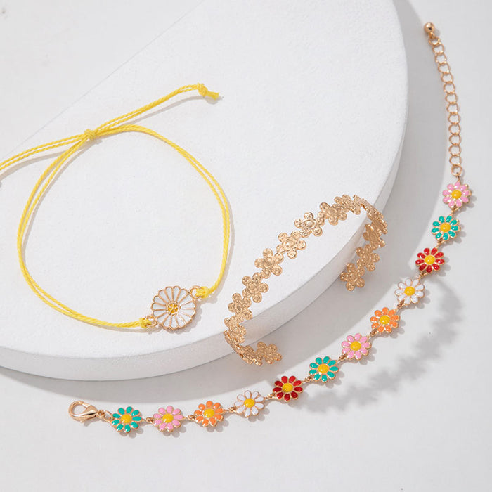 Conjunto de pulseras con flores de margaritas: joyería de mujer en tres piezas en tonos pastel