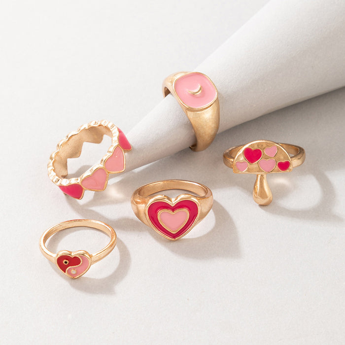 Anillo de 5 piezas con forma de hongo y corazón rosa con forma de gota de aceite de Tai Chi