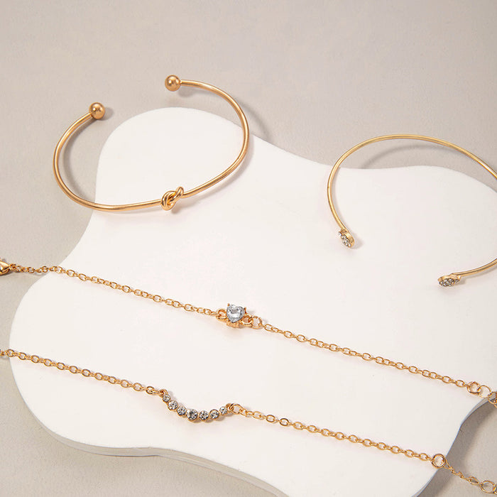 Conjunto de pulseras con forma de corazón y sonrisa: joyería de mujer con puño abierto de cuatro piezas