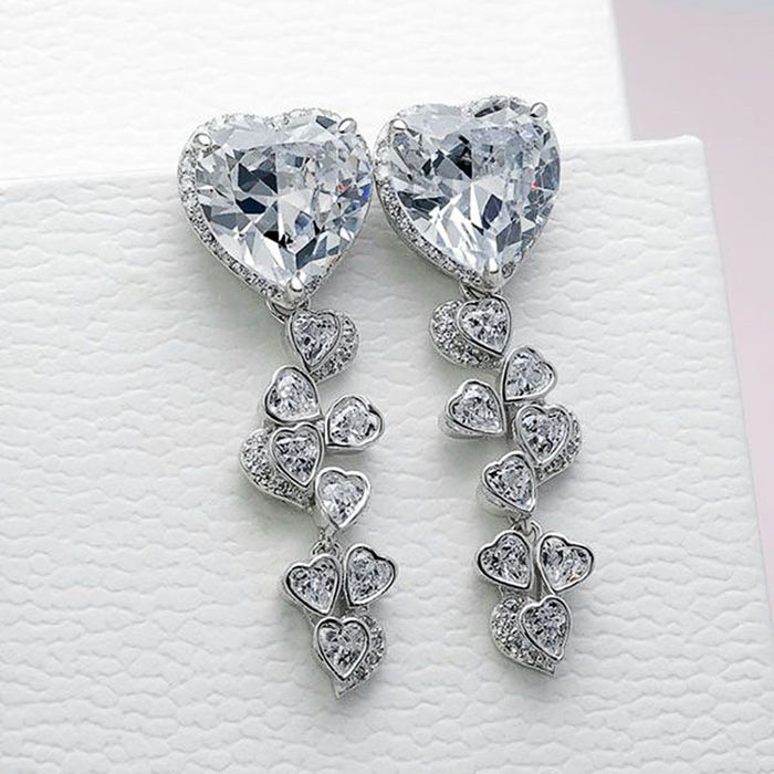 Pendientes largos con borlas y circonitas Love