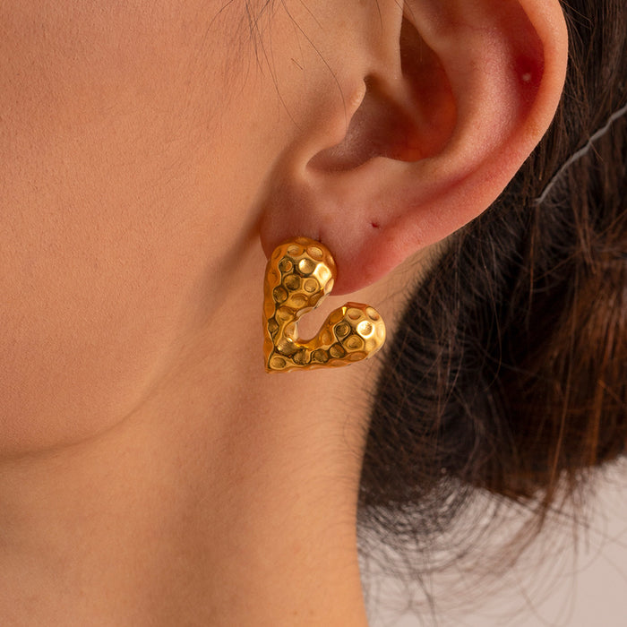 Pendientes de botón con forma de corazón líquido de acero inoxidable y oro de 18 quilates de tendencia europea: joyería de diseñador para venta al por mayor