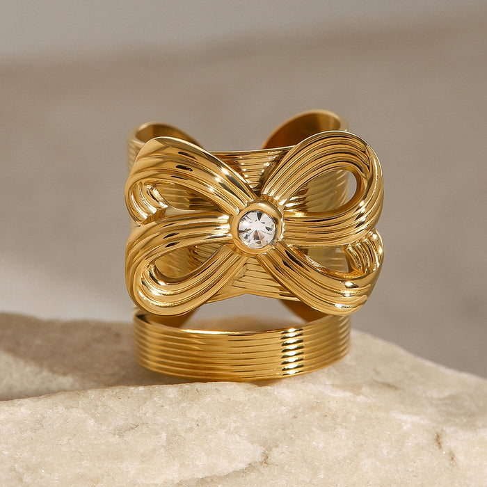 Stainless steel bow ring with diamonds