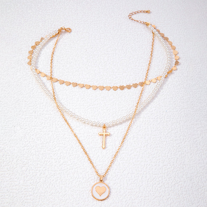 Heart Pendant Necklace with Cross and Pearl Charms - Geometric Multilayered Jewelry for Women