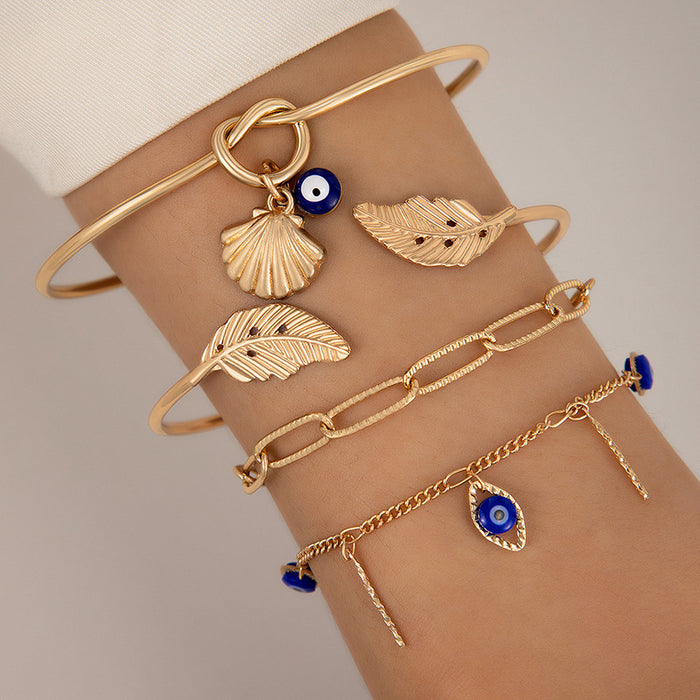 Conjunto de pulseras retro con hojas y nudos: pulsera de cuatro piezas con ojos y conchas marinas