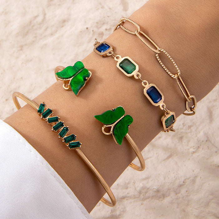 Conjunto de pulseras de piedras preciosas verdes con puño abierto de mariposa: elegante conjunto de cuatro piezas de joyería