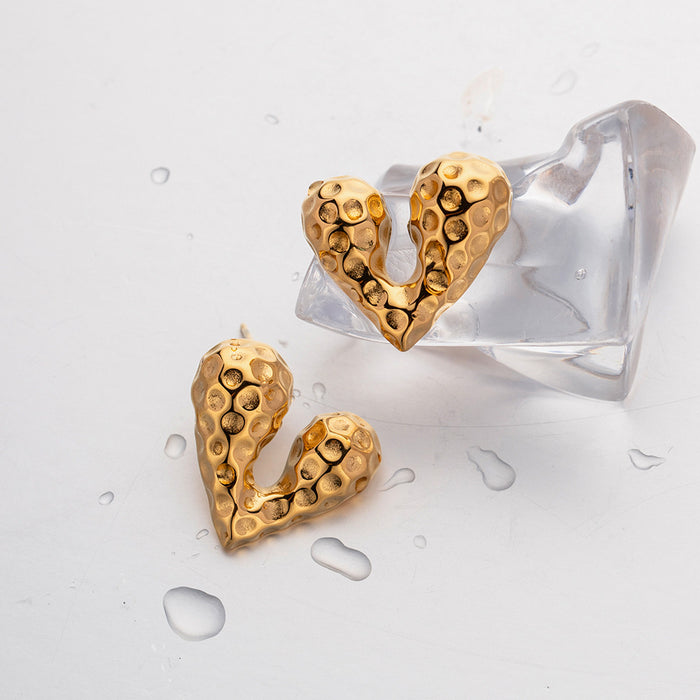 Pendientes de botón con forma de corazón líquido de acero inoxidable y oro de 18 quilates de tendencia europea: joyería de diseñador para venta al por mayor