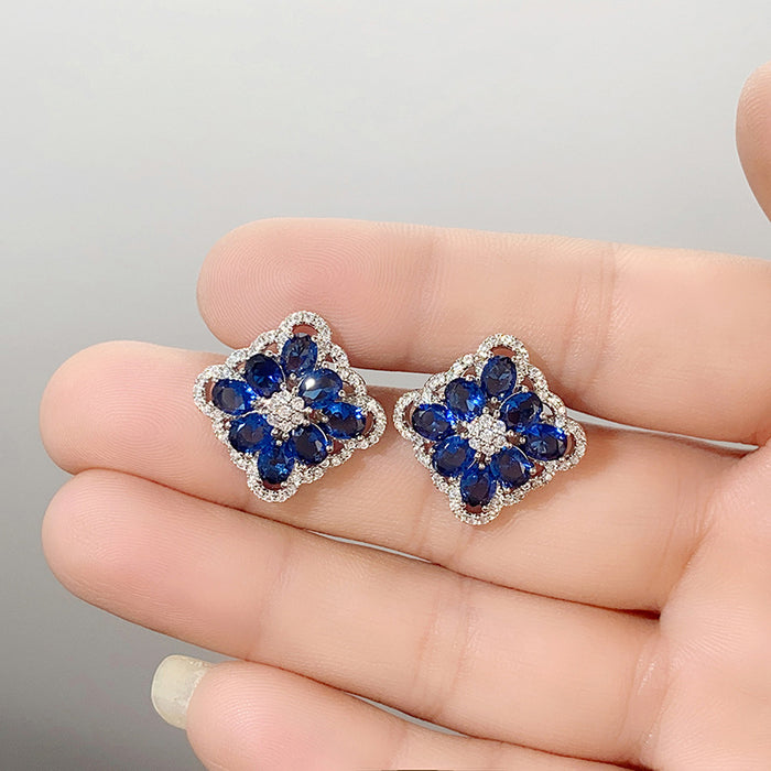 Blue enchantress flower earrings