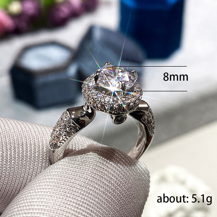 Anillo femenino de moda con diamantes redondos y circonitas nobles para bodas