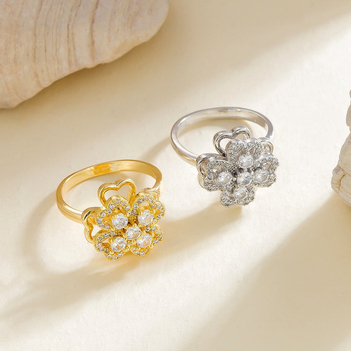 Wholesale micro-painted zircon and pearl four-leaf clover rotating open ring