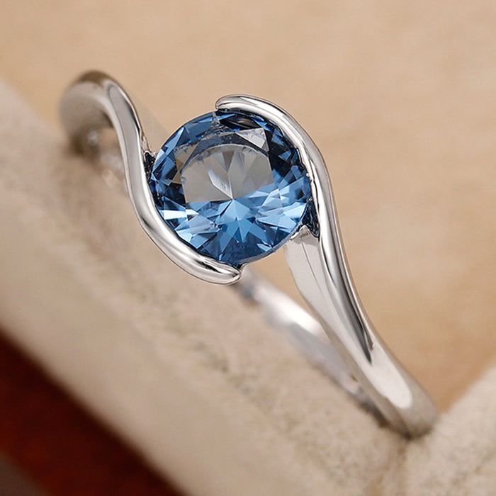 Anillo de mujer sencillo con brazo torcido, diamante redondo azul, circonita y topacio