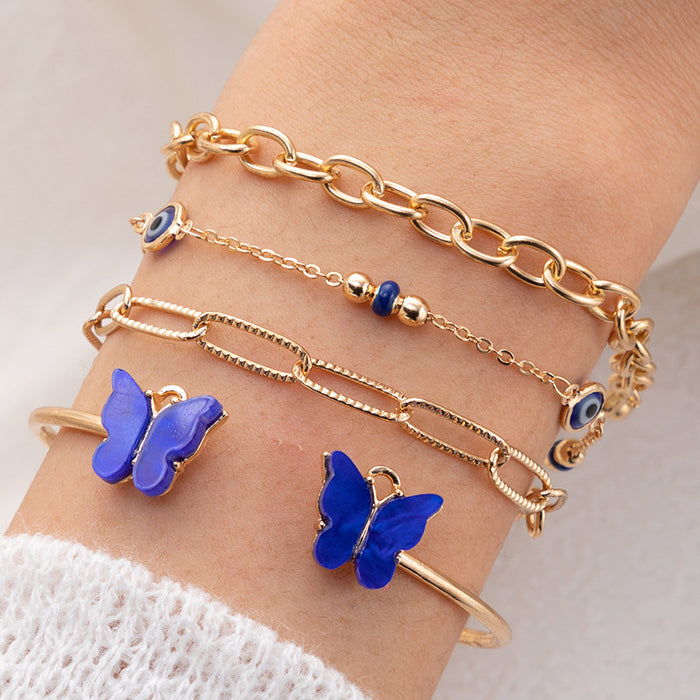 Conjunto de pulseras de mariposas azules galvanizadas: joyería de aleación de cuatro piezas para mujeres