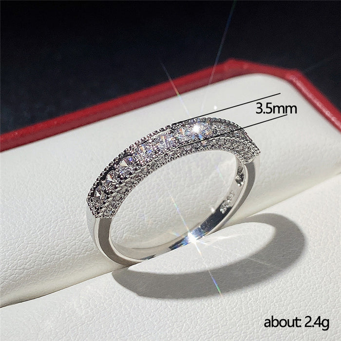 Anillo unisex con incrustaciones de circonitas y placa de cobre