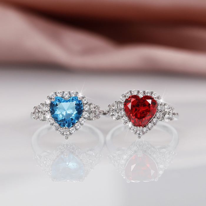 Conjunto de anillo y pendientes con forma de corazón de océano y circonita azul topacio