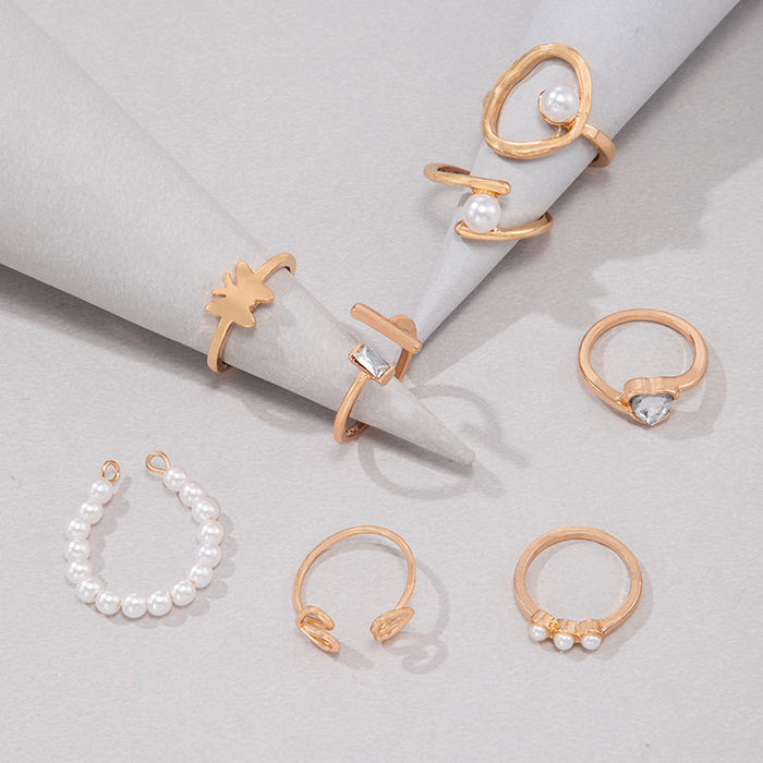 Pearl-inlaid hollow heart irregular opening eight-piece ring set