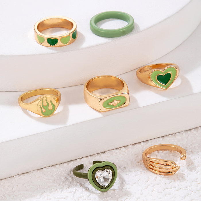 Juego de anillos de palma con forma de llama de amor y goteo de aceite verde, conjunto de siete piezas con forma de corazón de resina geométrica