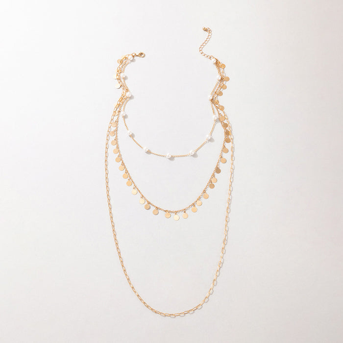 Pearl and Metal Multi-Layer Necklace with Geometric Round Disc Design